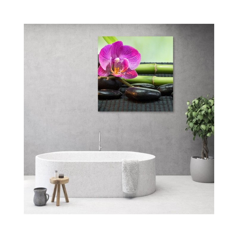 Leinwandbild - Orchidee auf schwarzen Steinen | Feeby