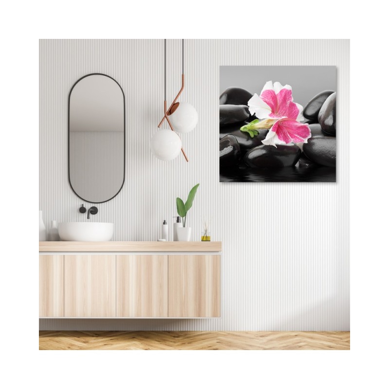 Leinwandbild - Rosa Blume auf Zen Stones | Feeby