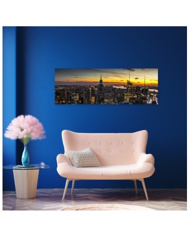 Bild - Stadt vor dem Hintergrund der untergehenden Sonne | Feeby